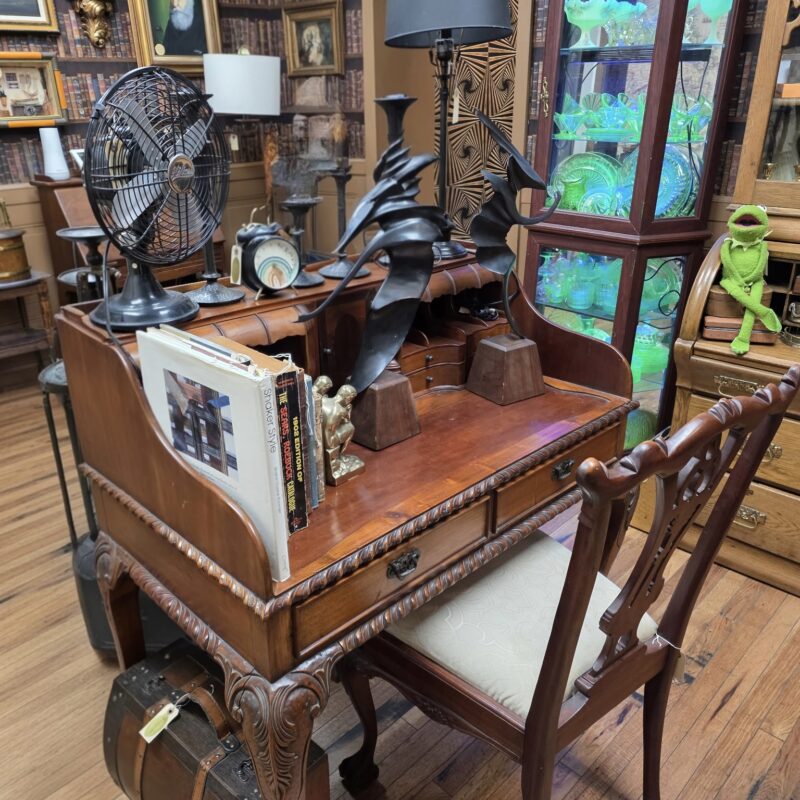 Queen Anne Revival writing desk and matching chair with cabriole legs, carved shell detailing, and upholstered seat — vintage hardwood furniture set.