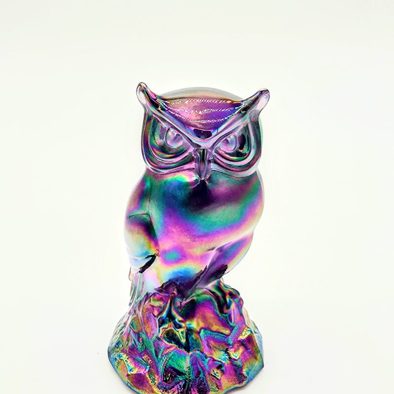 Iridescent carnival glass owl figurine with multicolor luster finish and detailed sculpting.