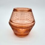 Vintage pink ribbed glass fairy light with soft blush tone and layered design.