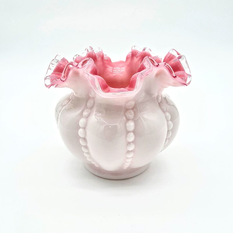 Short rounded Fenton pink and white satin glass vase with ruffled edge and beaded design.